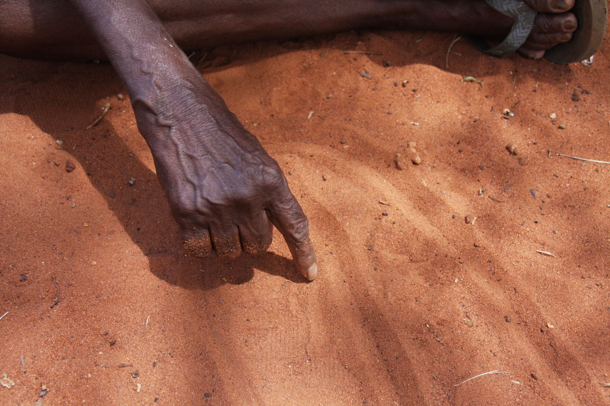 Hand Drawing In The Sand